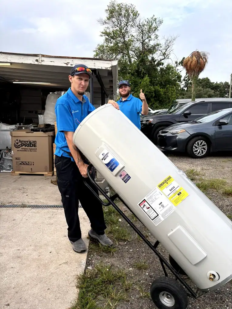 Comfort Authority technicians moving a new water heater