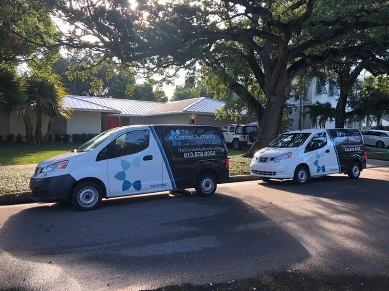 Comfort Authority service vans parked on a residential street