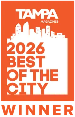 Award badge for Tampa Magazine 2026 Best of the City winner with orange background and white skyline silhouette.