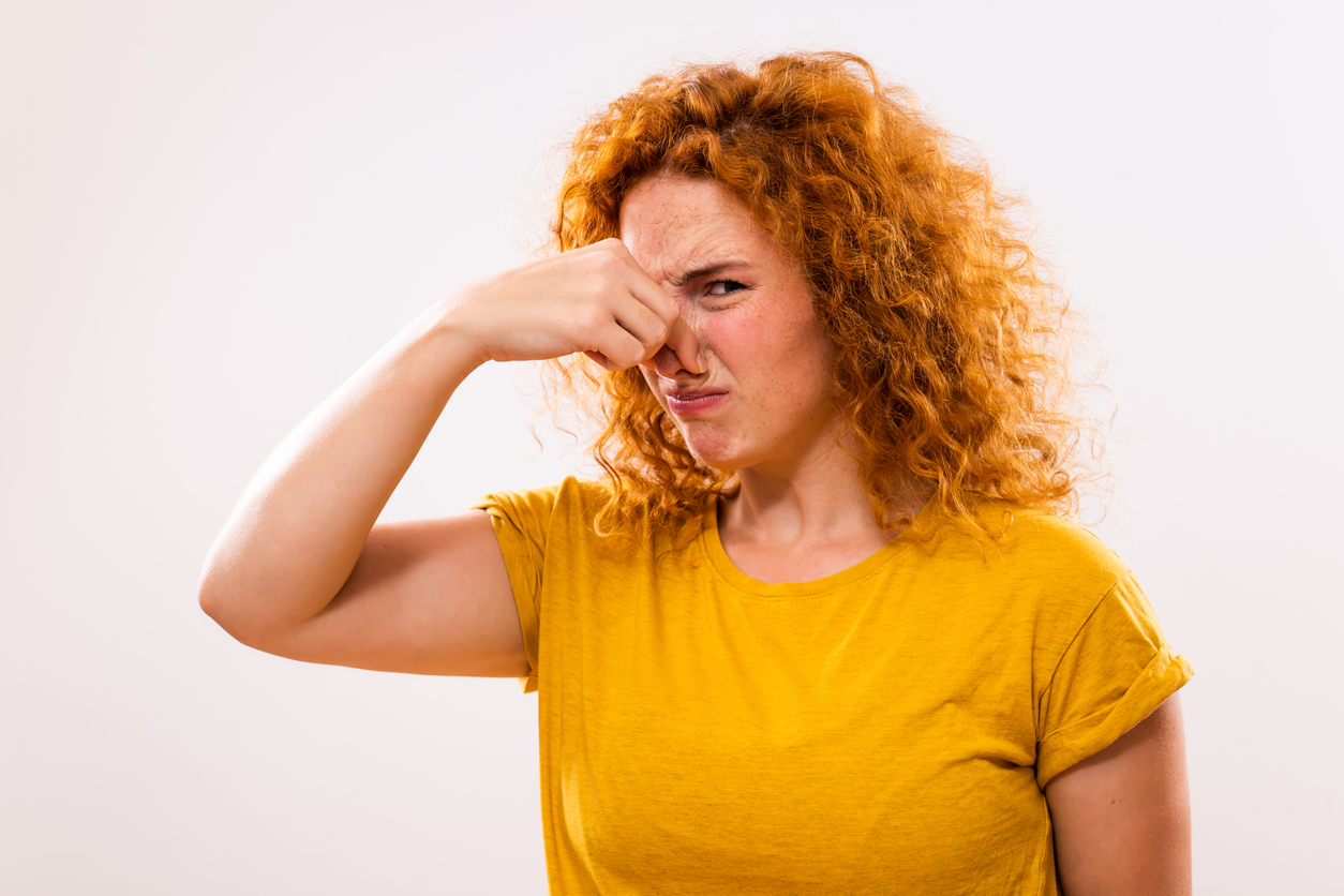 Woman Holding Her Nose