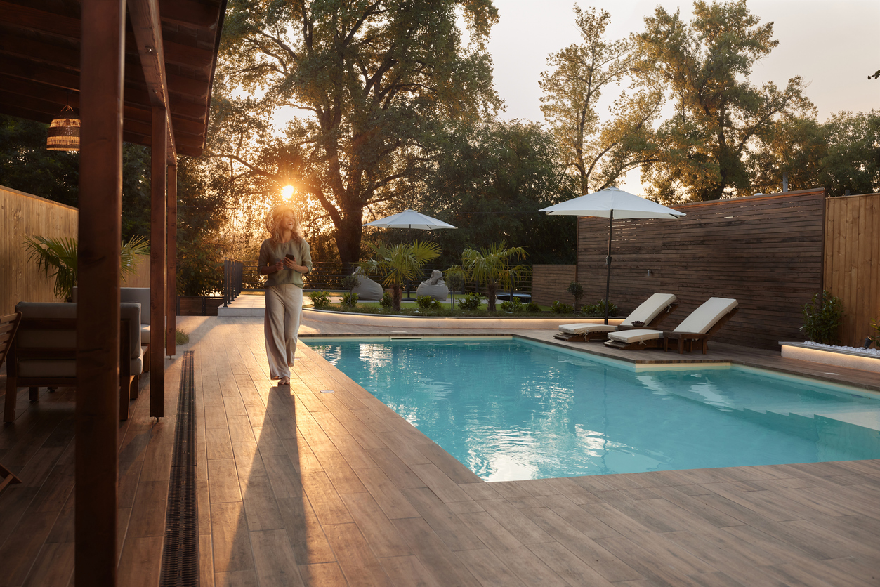 Woman in Backyard with Pool
