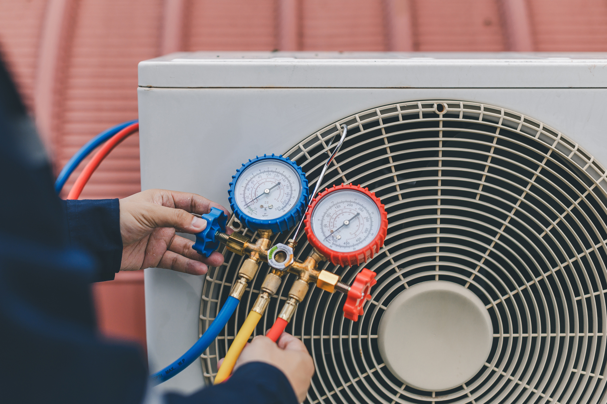 Tech Servicing AC Unit