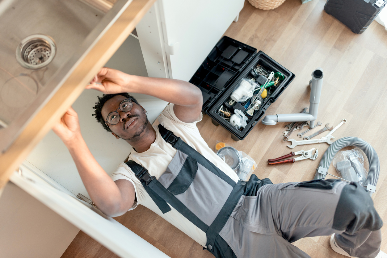 Plumber Fixing Sink