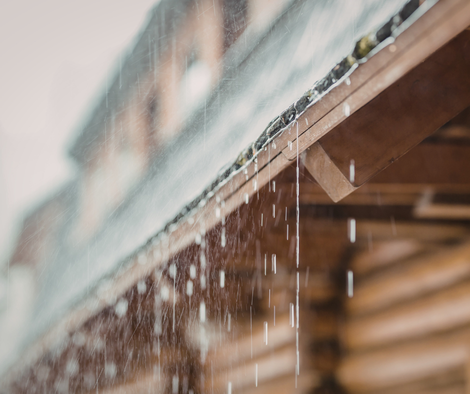 rain falling off gutters on house