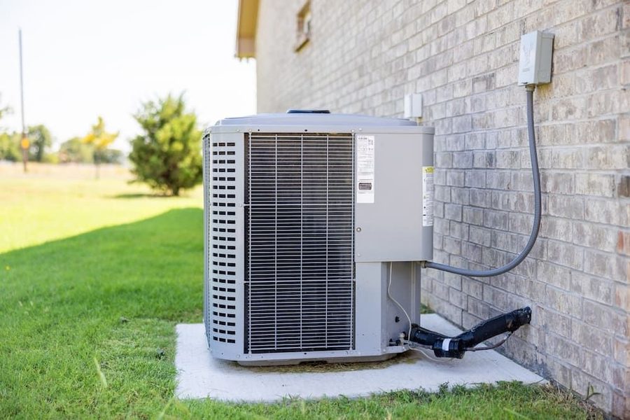 Modern outdoor air conditioning system on the side of a house
