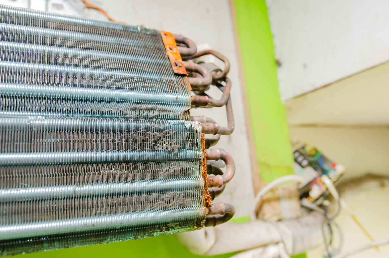 Dirty AC coil with dust and dirt on it
